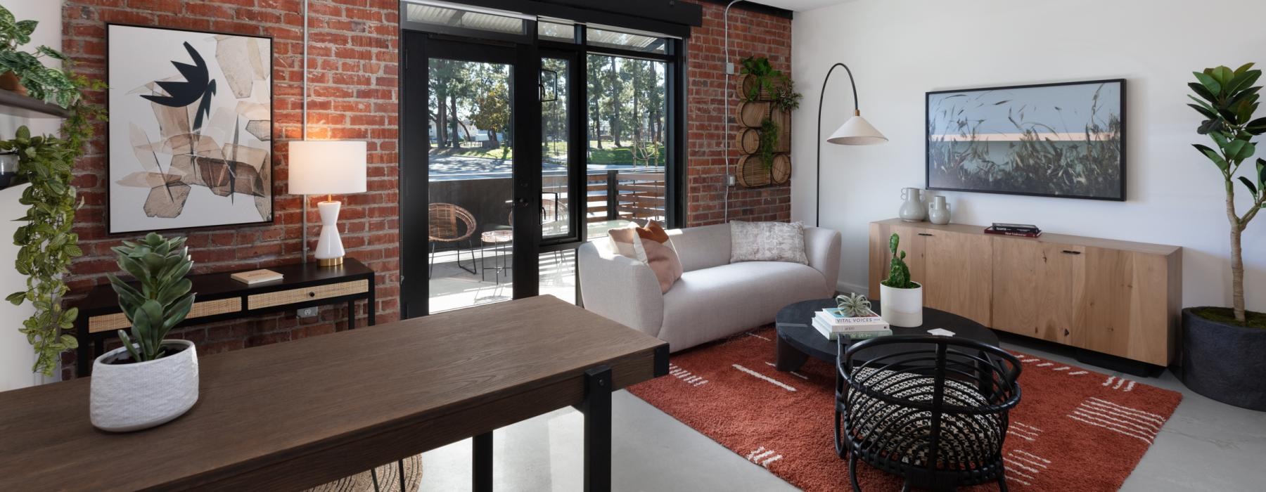 a living room with a table and chairs