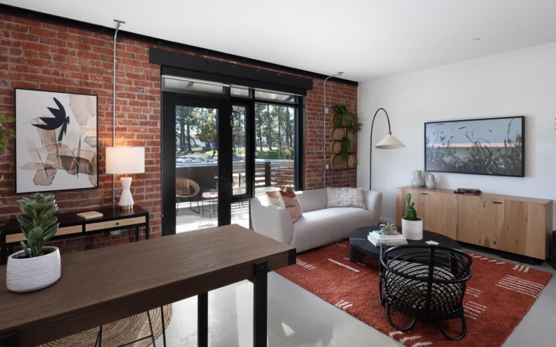 a living room with a table and chairs