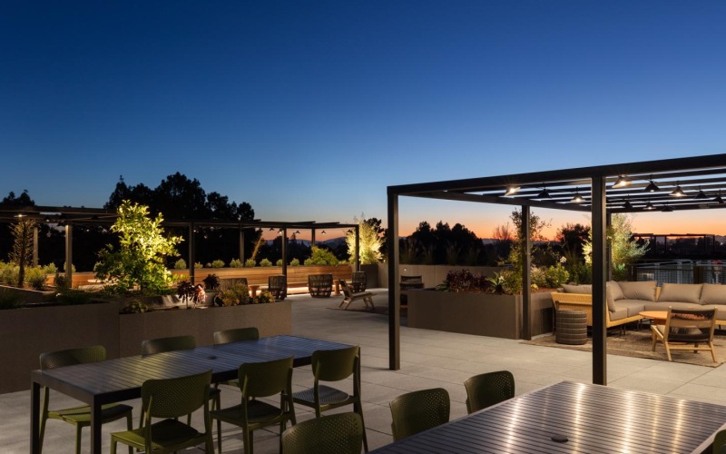 a patio with tables and chairs